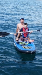 Elliott & Daddy paddling while we anchored at Isla Venderas
